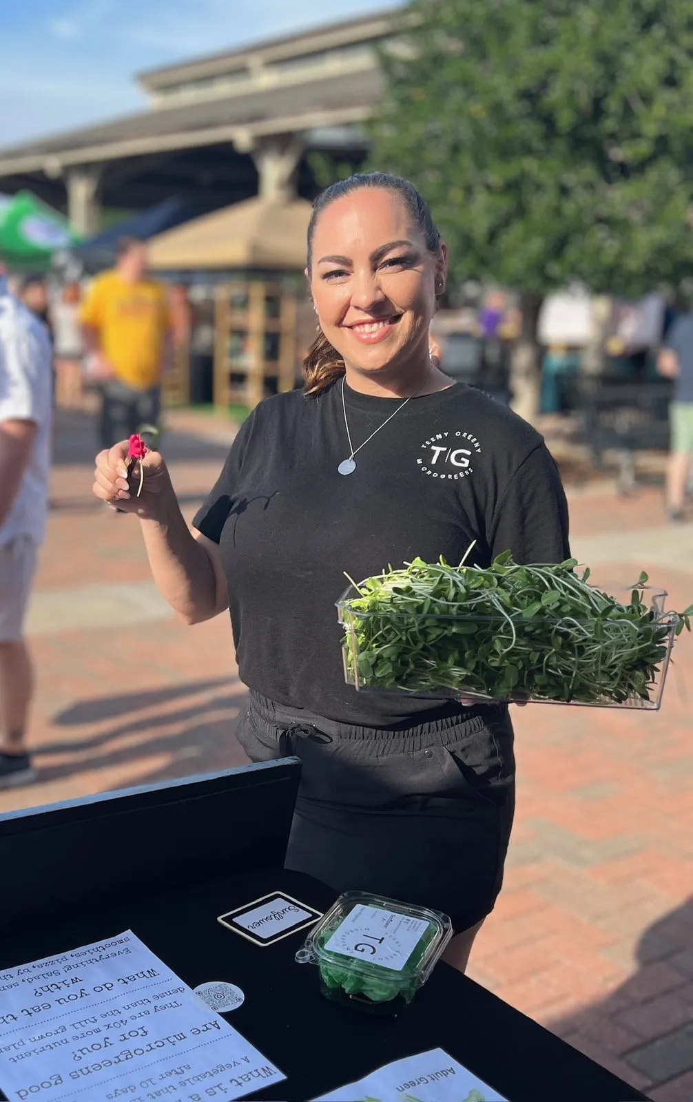 Brooke with her fresh microgreens at the farmers market